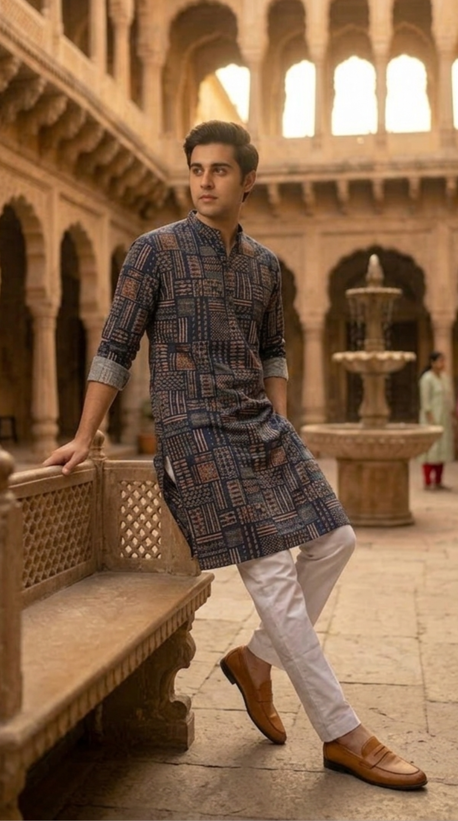 Navy blue patchwork block print cotton kurta for men with mandarin collar and rolled sleeves — heritage lifestyle shot